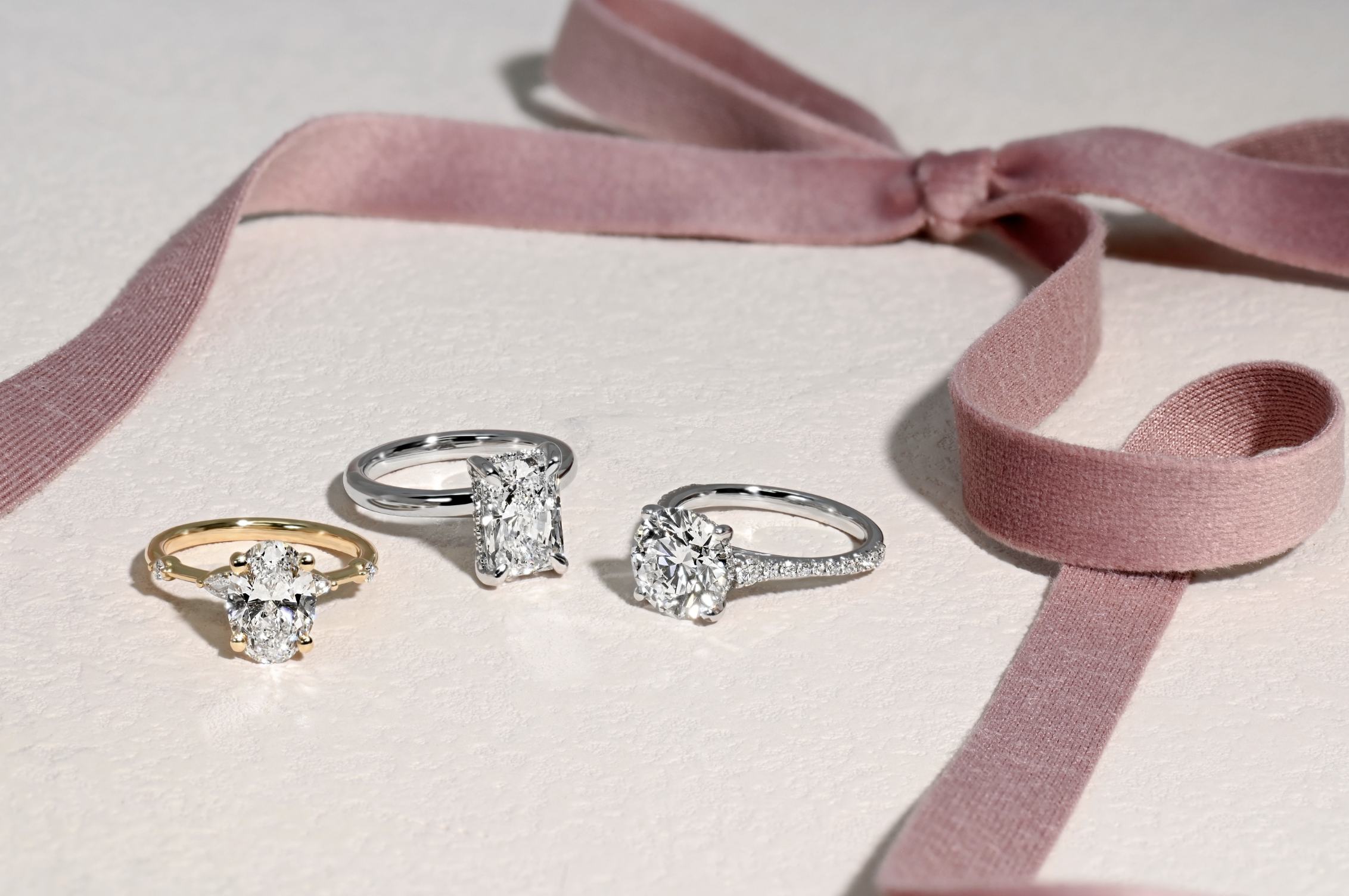 three large-diamond engagement rings