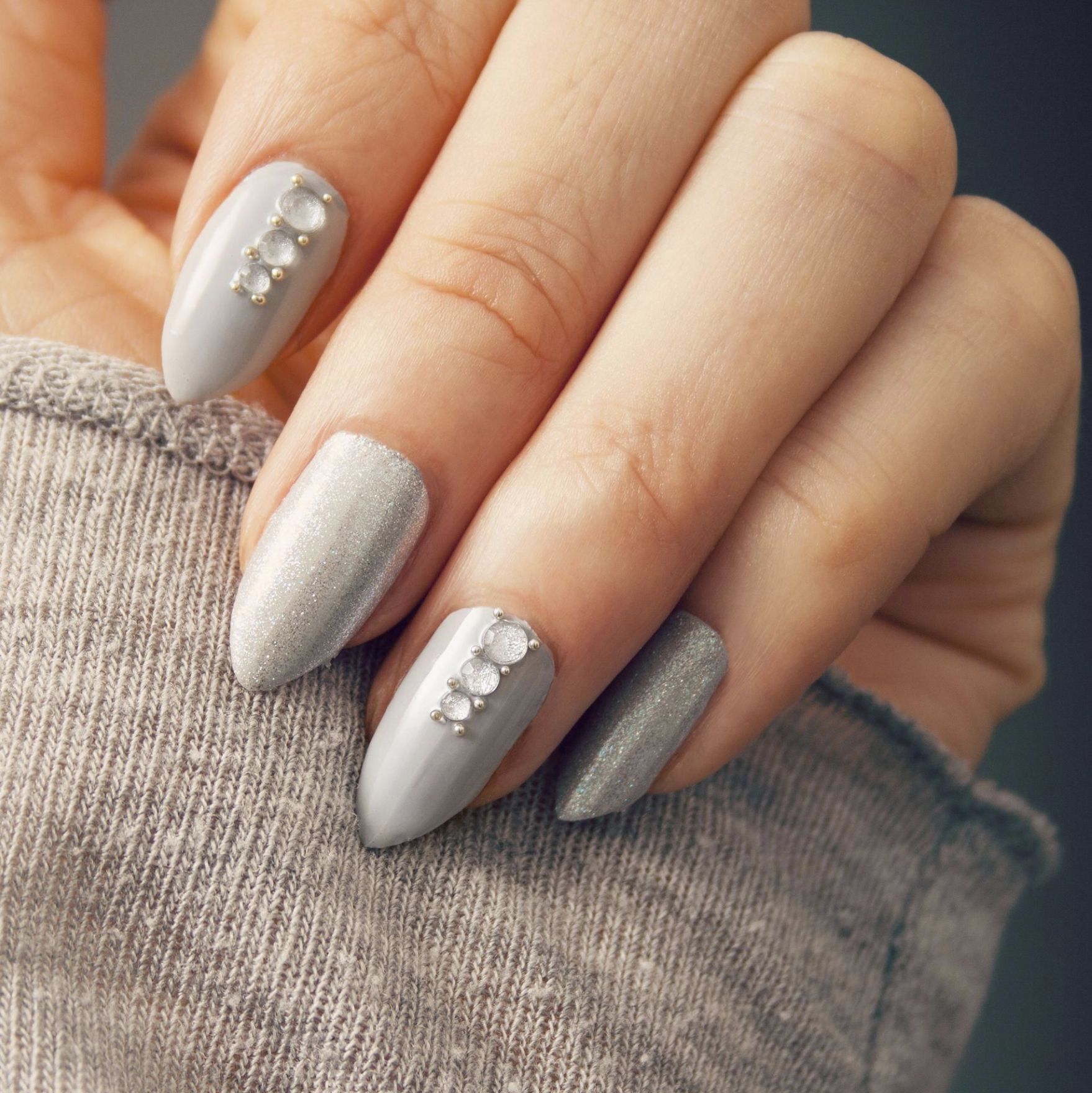 grey manicure with crystal nail art