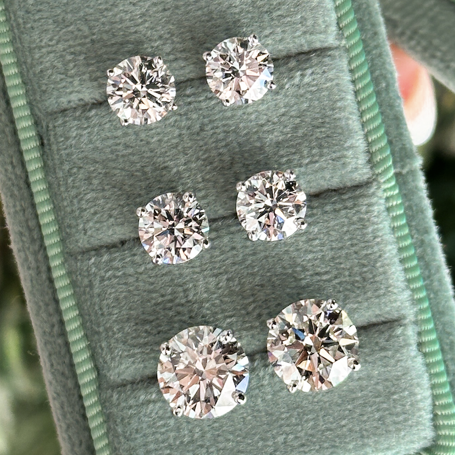 four prong round brilliant diamond stud earrings