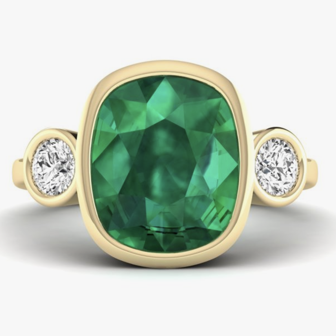 yellow gold bezel mounted emerald cocktail ring