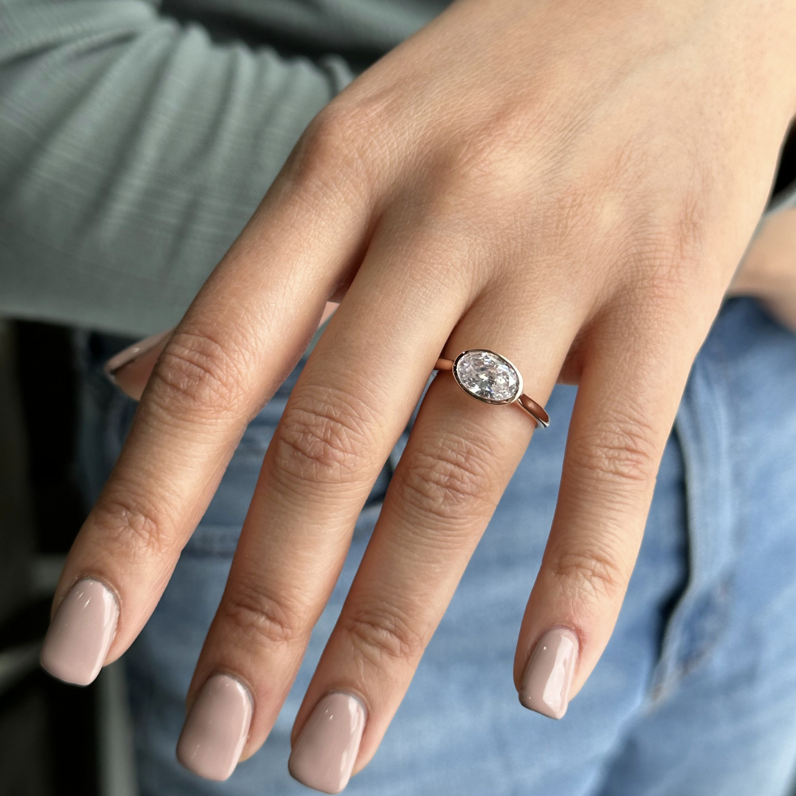 east west ring, oval diamond engagement ring, bezel mounting oval diamond engagement ring
