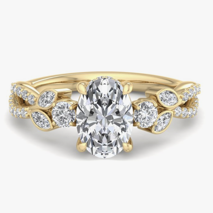romantic oval diamond engagement ring with bevel mounted side diamonds and pave shank