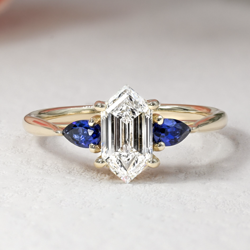trapezoidal diamond and sapphire yellow gold engagement ring