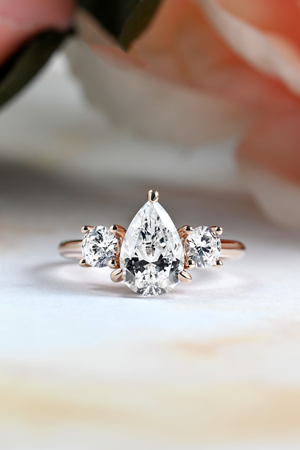 pear shaped diamond three-stone engagement ring