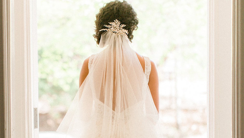 bride looking out window, bride's veil, bridal veil, hair accessory, bridal hair style