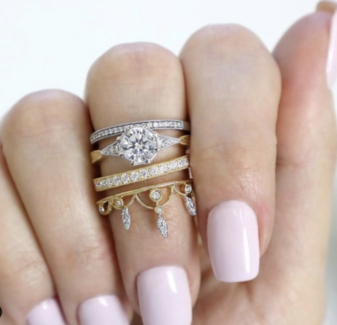 woman wearing mixed metal stackable diamond rings