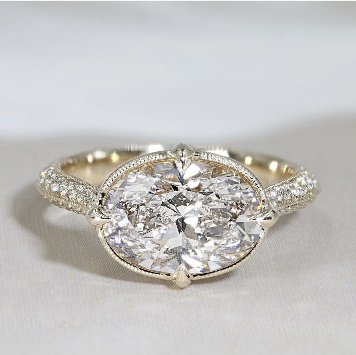 oval east west engagement ring, bezel setting oval diamond ring, filigree and oval diamond engagement ring