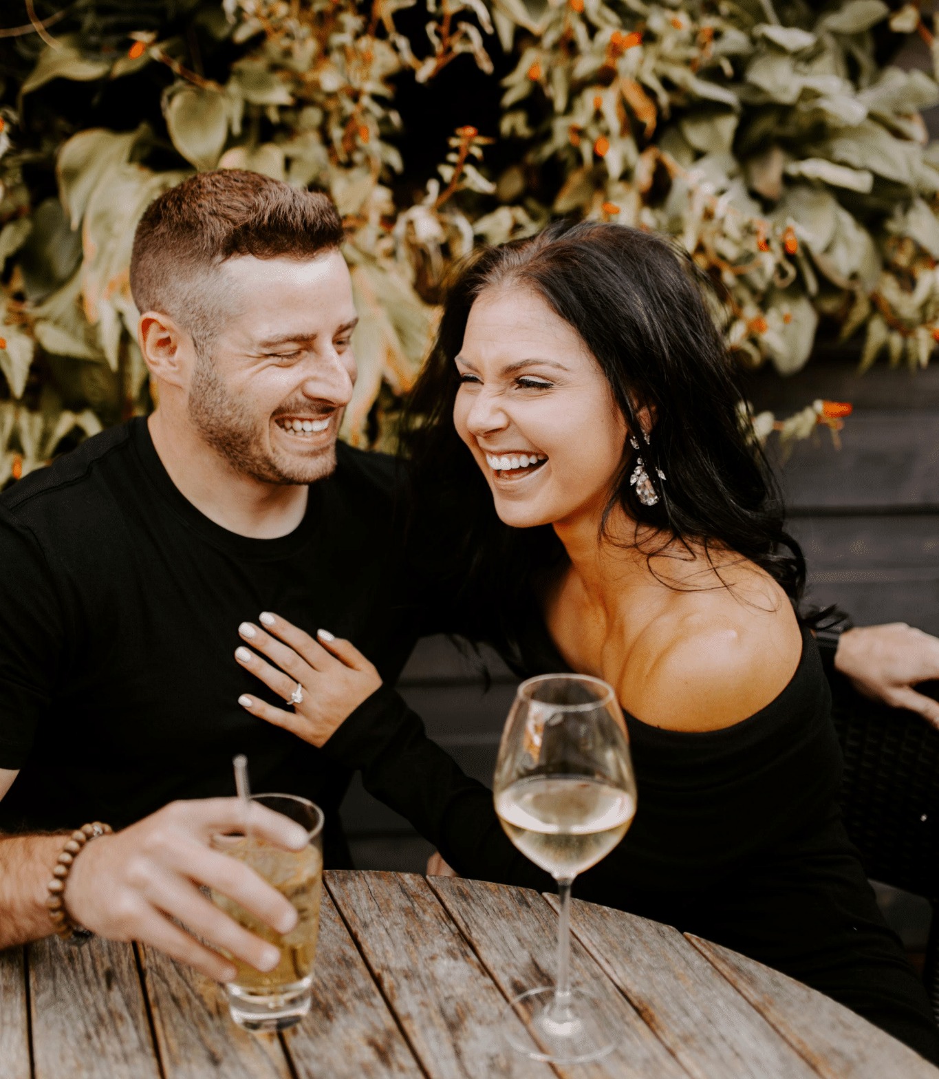 cute couple, brunette, chandelier earrings, crystal earrings, black clothes, first anniversary, engagement photo