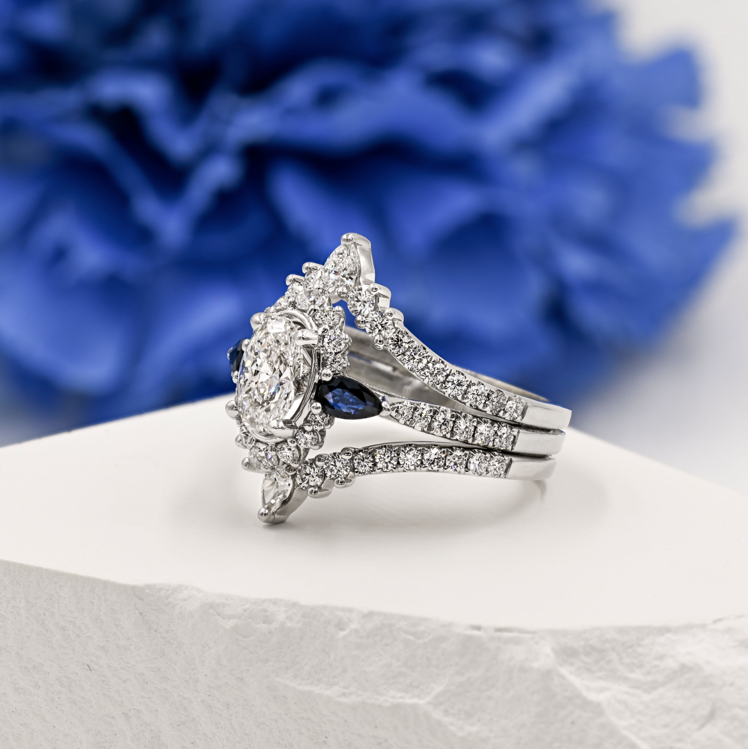 white gold split shank halo oval diamond and sapphire engagement ring