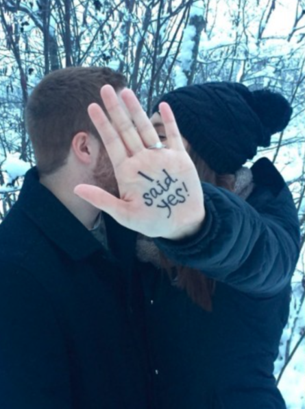 wedding announcement idea, cute wedding announcement, engagement photo, hand, kissing couple, couple in winter, trees, snow, stocking caps,