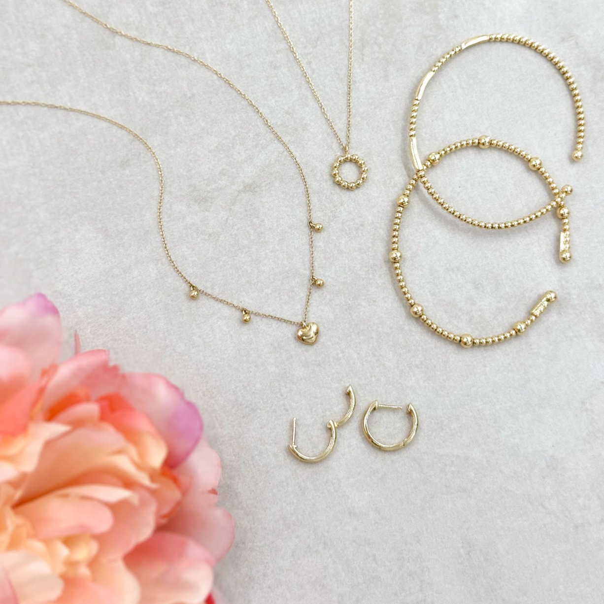 gold jewelry, gold bracelets, necklaces, and earrings