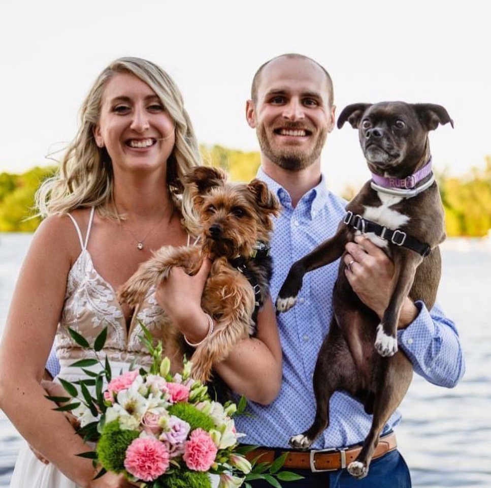 wedding couple by  lake, pink wedding bouquet, happy bride, dog wedding photo, pet wedding photo