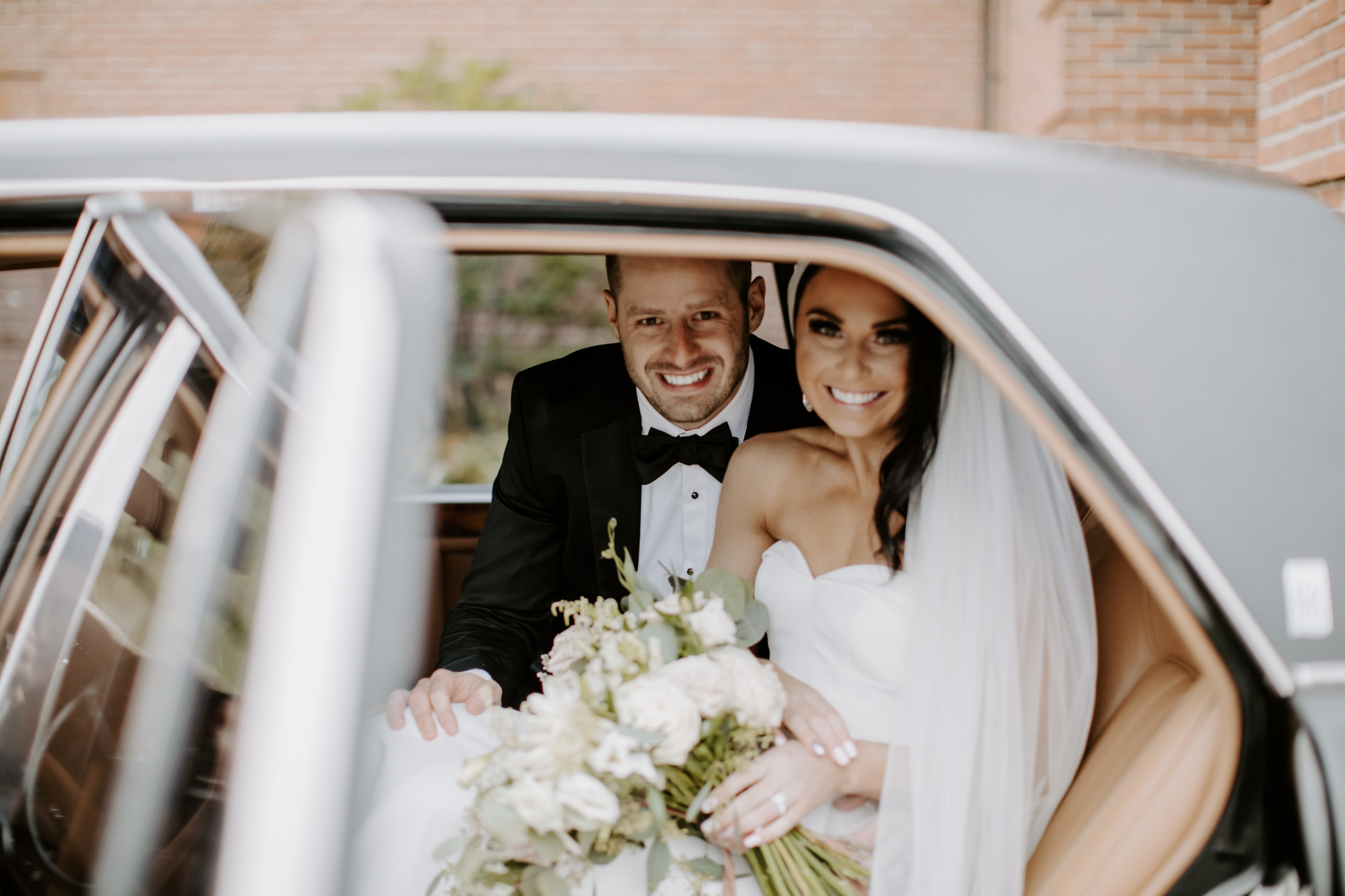 bride and groom, just married car, bride and groom in car