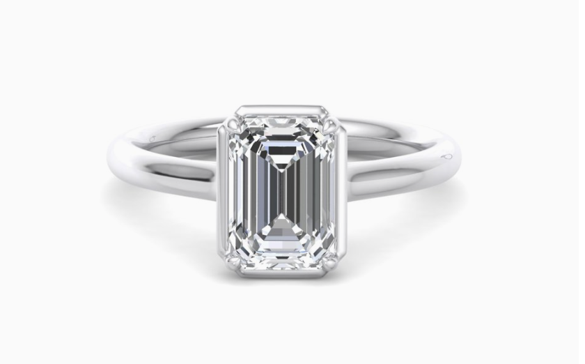 emerald cut bezel mounted diamond solitaire engagement ring