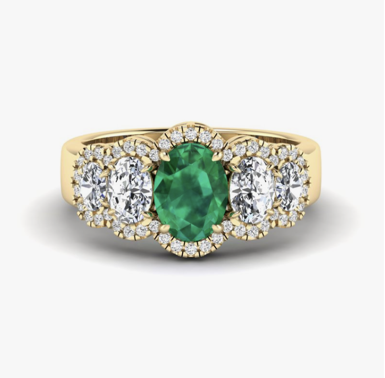emerald and diamond five-stone engagement ring with halo in yellow gold
